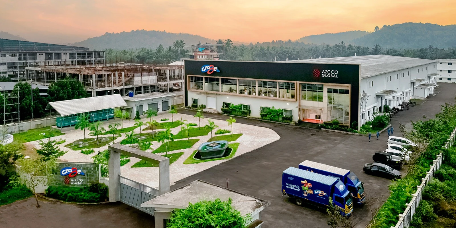 Craze Azcco Global manufacturing facility with delivery trucks